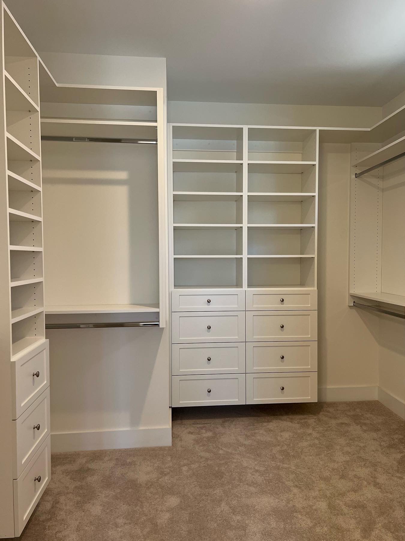 Walk-in closet with shaker-style drawers built by Millcraft