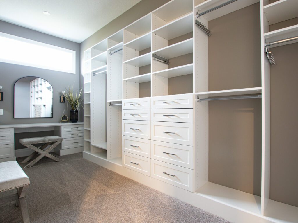 Finished walk-in closet with a built-in vanity desk