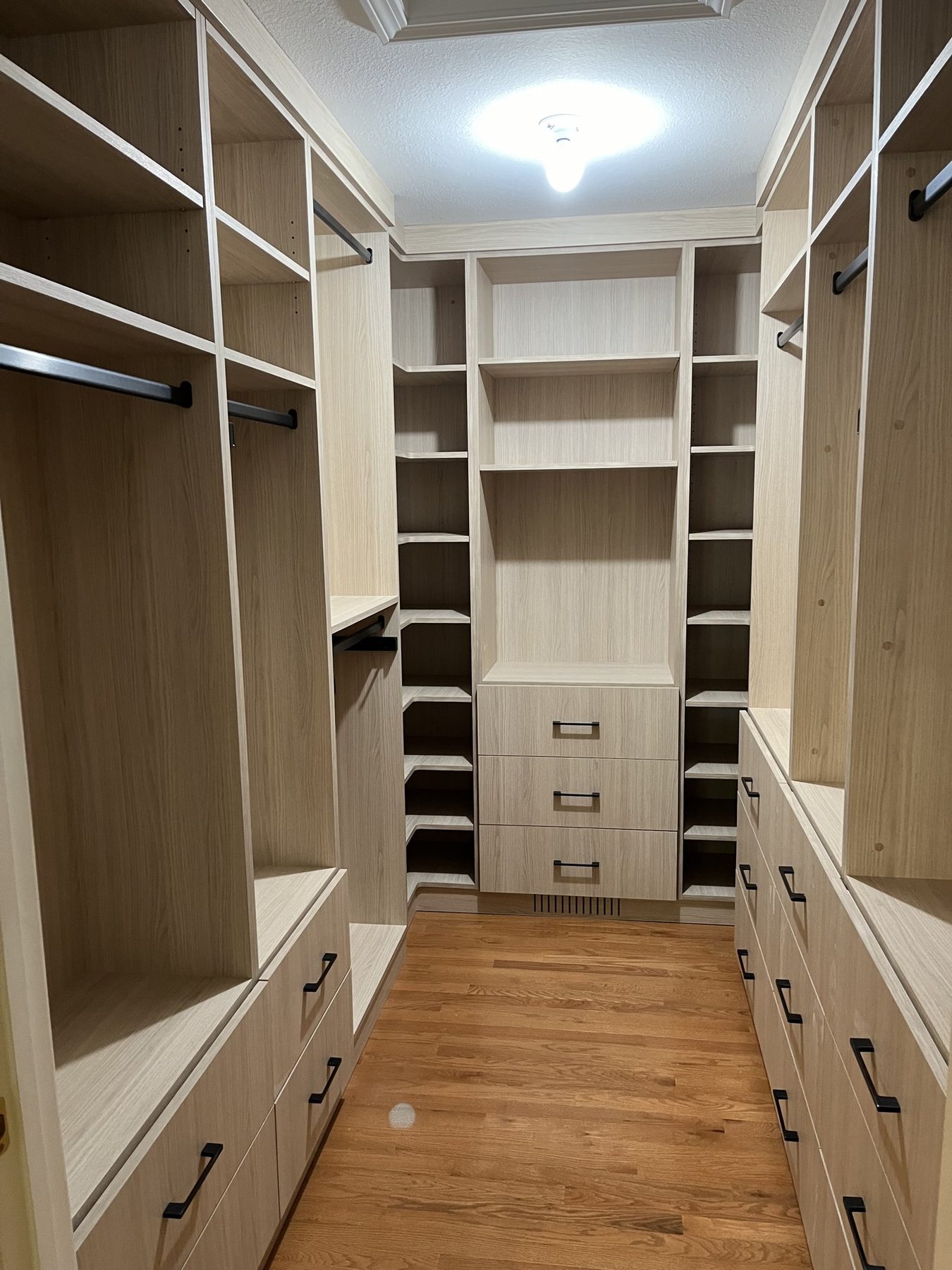 White oak walk-in closet corner